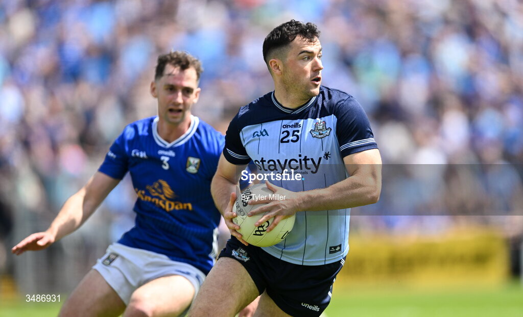 14 June 2026; Colm Basquel of Dublin in action against Brían O'Connell of Cavan during the GAA Football All-Ireland Senior Championship Round 2B match between Cavan and Dublin at Kingspan Breffni in Cavan. Photo by Tyler Miller/Sportsfile