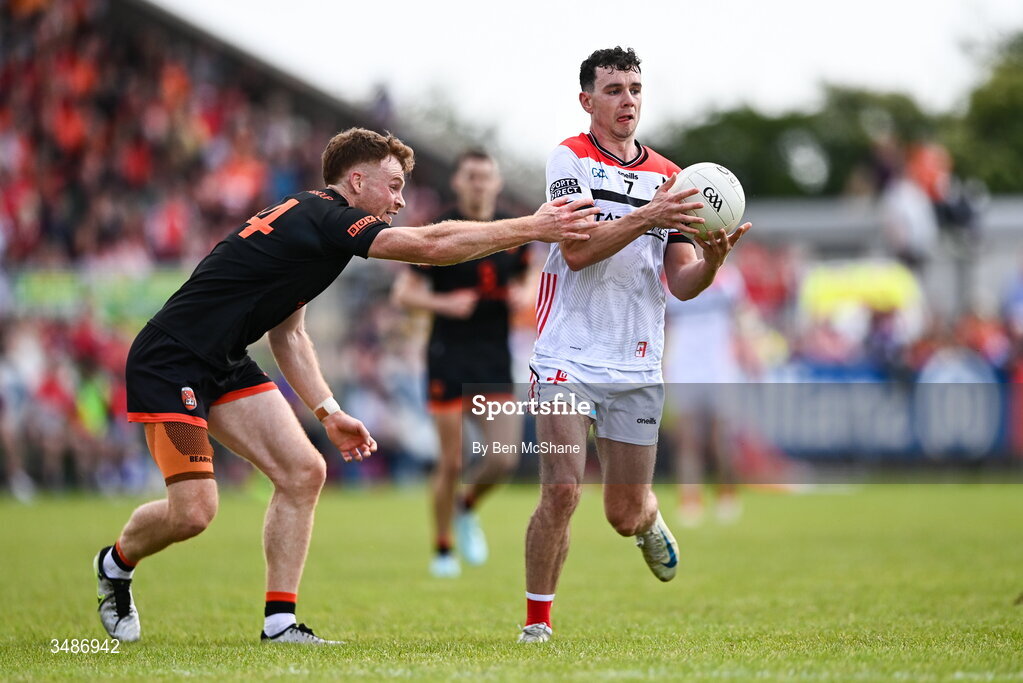 14 June 2026; Craig Lennon of Louth in action against Jason Duffy of Armagh during the GAA Football All-Ireland Senior Championship Round 2A match between Louth and Armagh at Páirc Grattan in Inniskeen, Monaghan. Photo by Ben McShane/Sportsfile