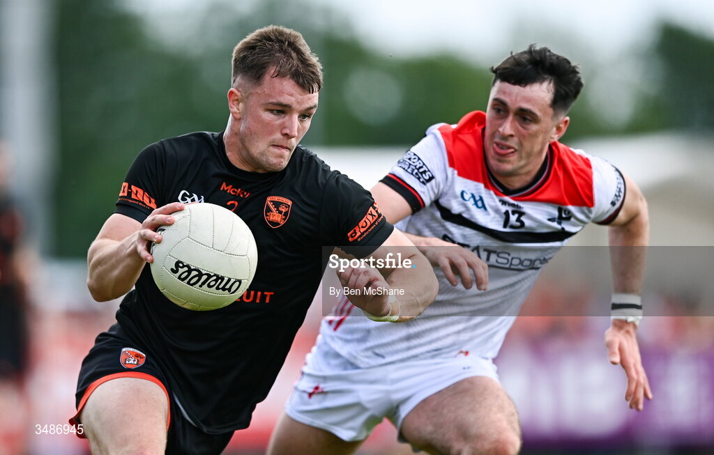 14 June 2026; Peter McGrane of Armagh in action against Kieran McArdle of Louth during the GAA Football All-Ireland Senior Championship Round 2A match between Louth and Armagh at Páirc Grattan in Inniskeen, Monaghan. Photo by Ben McShane/Sportsfile