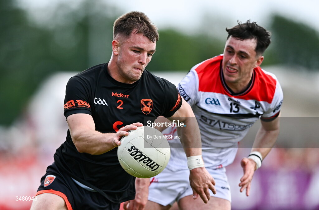 14 June 2026; Peter McGrane of Armagh in action against Kieran McArdle of Louth during the GAA Football All-Ireland Senior Championship Round 2A match between Louth and Armagh at Páirc Grattan in Inniskeen, Monaghan. Photo by Ben McShane/Sportsfile
