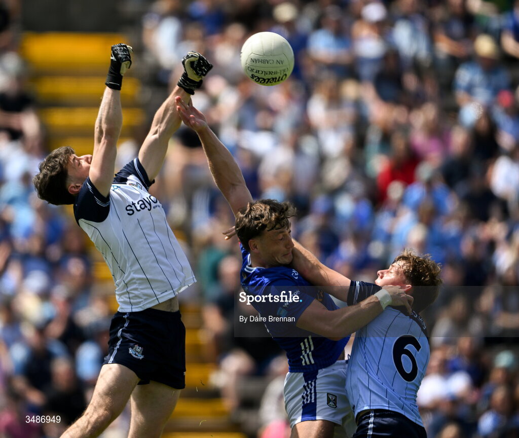 14 June 2026; Evan Comerford, left, and Charlie McMorrow of Dublin in action against Conor Brady of Cavan during the GAA Football All-Ireland Senior Championship Round 2B match between Cavan and Dublin at Kingspan Breffni in Cavan. Photo by Daire Brennan/Sportsfile