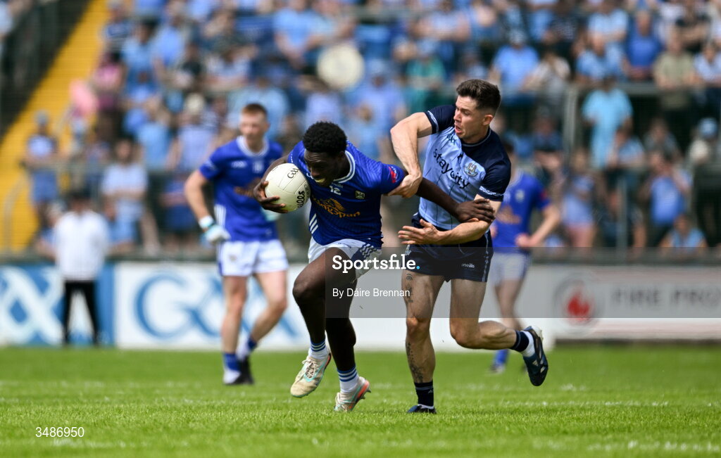 14 June 2026; Emmanuel Shehu of Cavan in action against David Byrne of Dublin during the GAA Football All-Ireland Senior Championship Round 2B match between Cavan and Dublin at Kingspan Breffni in Cavan. Photo by Daire Brennan/Sportsfile