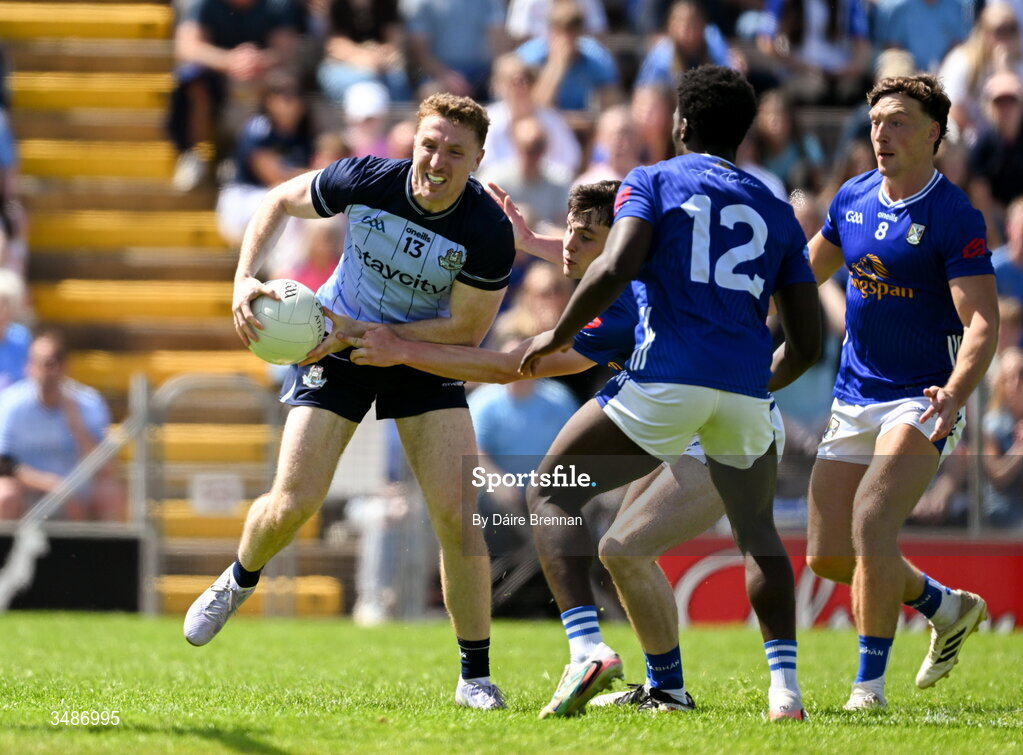 14 June 2026; Paddy Small of Dublin in action against Jensen Tynan of Cavan during the GAA Football All-Ireland Senior Championship Round 2B match between Cavan and Dublin at Kingspan Breffni in Cavan. Photo by Daire Brennan/Sportsfile