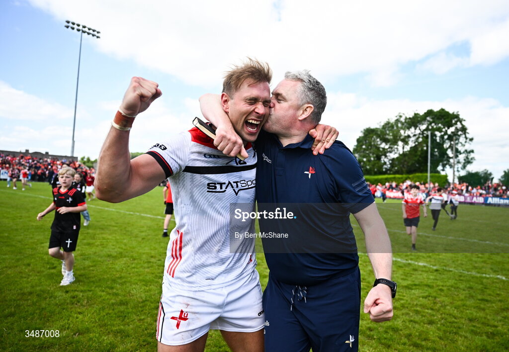14 June 2026; Louth manager Gavin Devlin celebrates with Conor Grimes of Louth after the GAA Football All-Ireland Senior Championship Round 2A match between Louth and Armagh at Páirc Grattan in Inniskeen, Monaghan. Photo by Ben McShane/Sportsfile