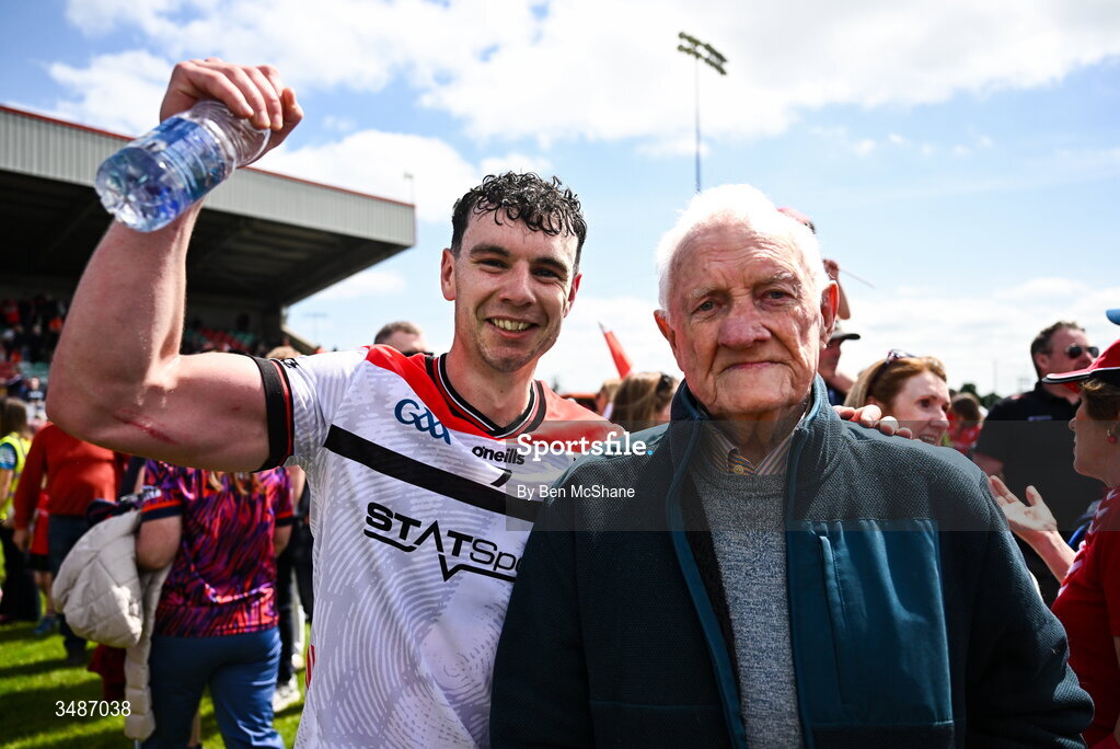 14 June 2026; Craig Lennon of Louth celebrates with his grandfather Stephy Gernon after the GAA Football All-Ireland Senior Championship Round 2A match between Louth and Armagh at Páirc Grattan in Inniskeen, Monaghan. Photo by Ben McShane/Sportsfile