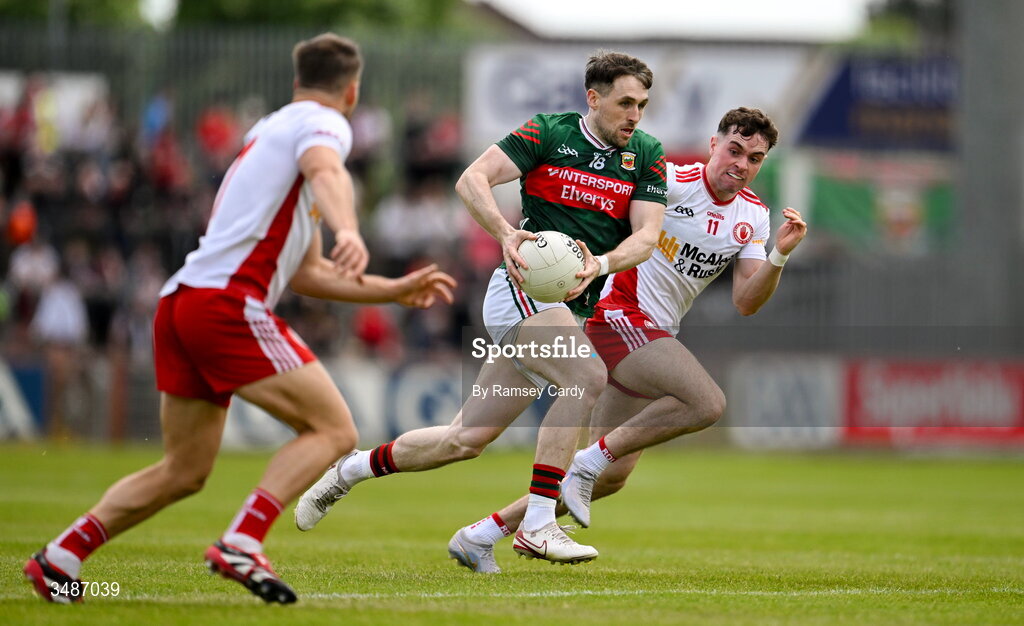 14 June 2026; Paddy Durcan of Mayo in action against Kieran McGeary, left, and Ronan Cassidy of Tyrone during the GAA Football All-Ireland Senior Championship Round 2A match between Tyrone and Mayo at O’Neills Healy Park in Omagh, Tyrone. Photo by Ramsey Cardy/Sportsfile