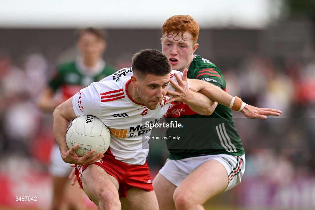 14 June 2026; Niall Devlin of Tyrone in action against Darragh Beirne of Mayo during the GAA Football All-Ireland Senior Championship Round 2A match between Tyrone and Mayo at O’Neills Healy Park in Omagh, Tyrone. Photo by Ramsey Cardy/Sportsfile