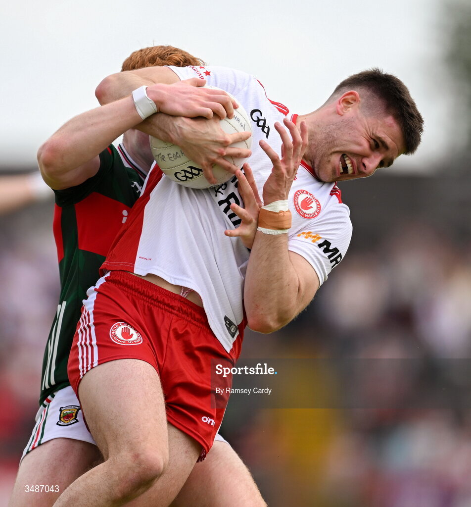14 June 2026; Niall Devlin of Tyrone in action against Darragh Beirne of Mayo during the GAA Football All-Ireland Senior Championship Round 2A match between Tyrone and Mayo at O’Neills Healy Park in Omagh, Tyrone. Photo by Ramsey Cardy/Sportsfile