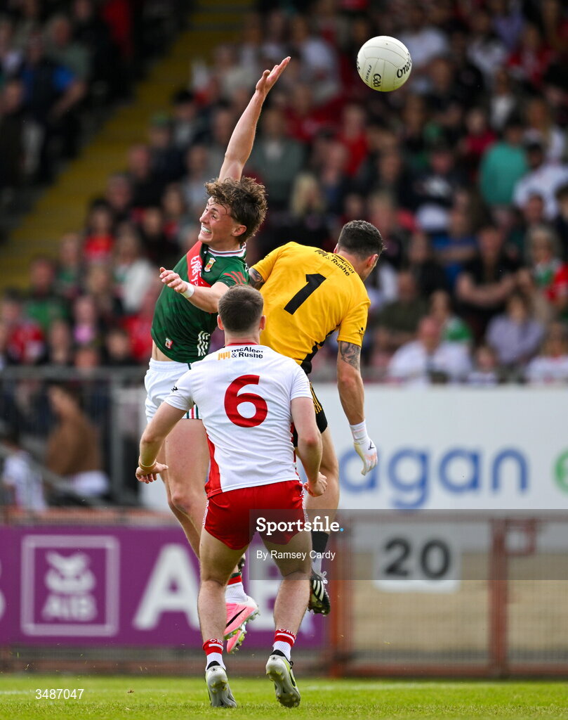 14 June 2026; Kobe McDonald of Mayo and Tyrone goalkeeper Niall Morgan during the GAA Football All-Ireland Senior Championship Round 2A match between Tyrone and Mayo at O’Neills Healy Park in Omagh, Tyrone. Photo by Ramsey Cardy/Sportsfile