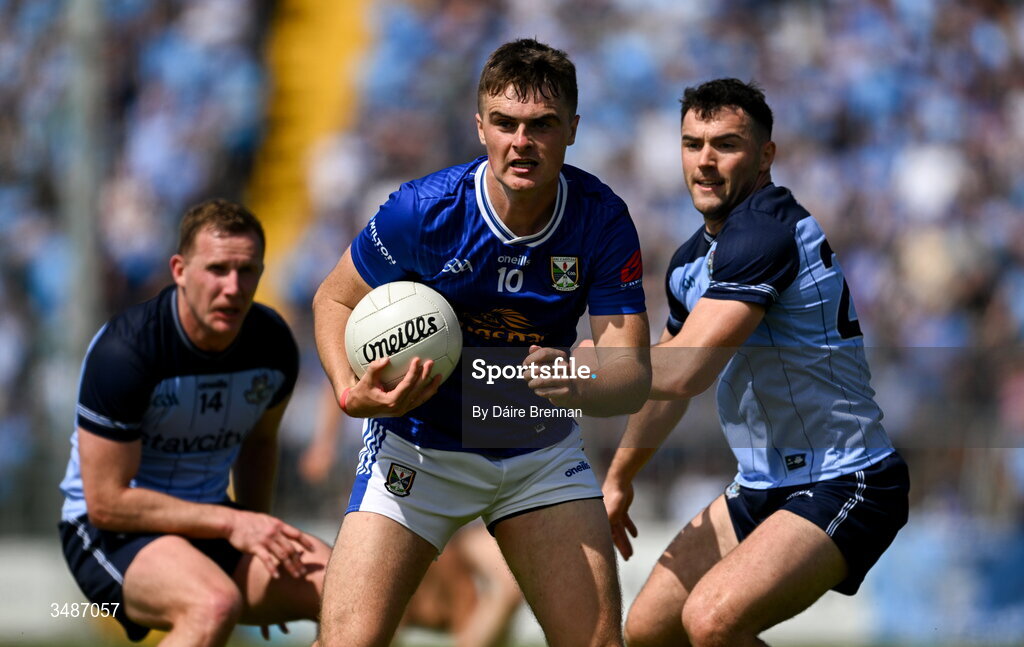 14 June 2026; Tiarnan Madden of Cavan in action against Ciarán Kilkenny, left, and Colm Basquel of Dublin during the GAA Football All-Ireland Senior Championship Round 2B match between Cavan and Dublin at Kingspan Breffni in Cavan. Photo by Daire Brennan/Sportsfile