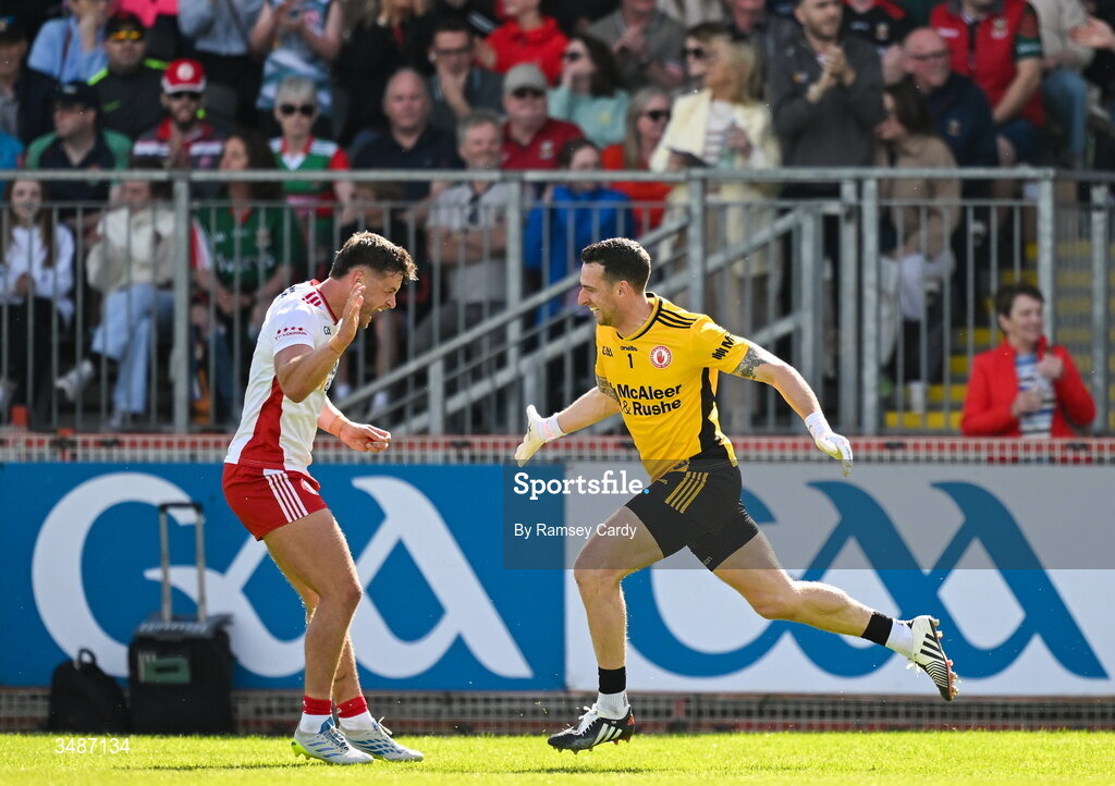 14 June 2026; Tyrone goalkeeper Niall Morgan, right, celebrates with Michael McKernan after kicking the match winning score in the GAA Football All-Ireland Senior Championship Round 2A match between Tyrone and Mayo at O’Neills Healy Park in Omagh, Tyrone. Photo by Ramsey Cardy/Sportsfile