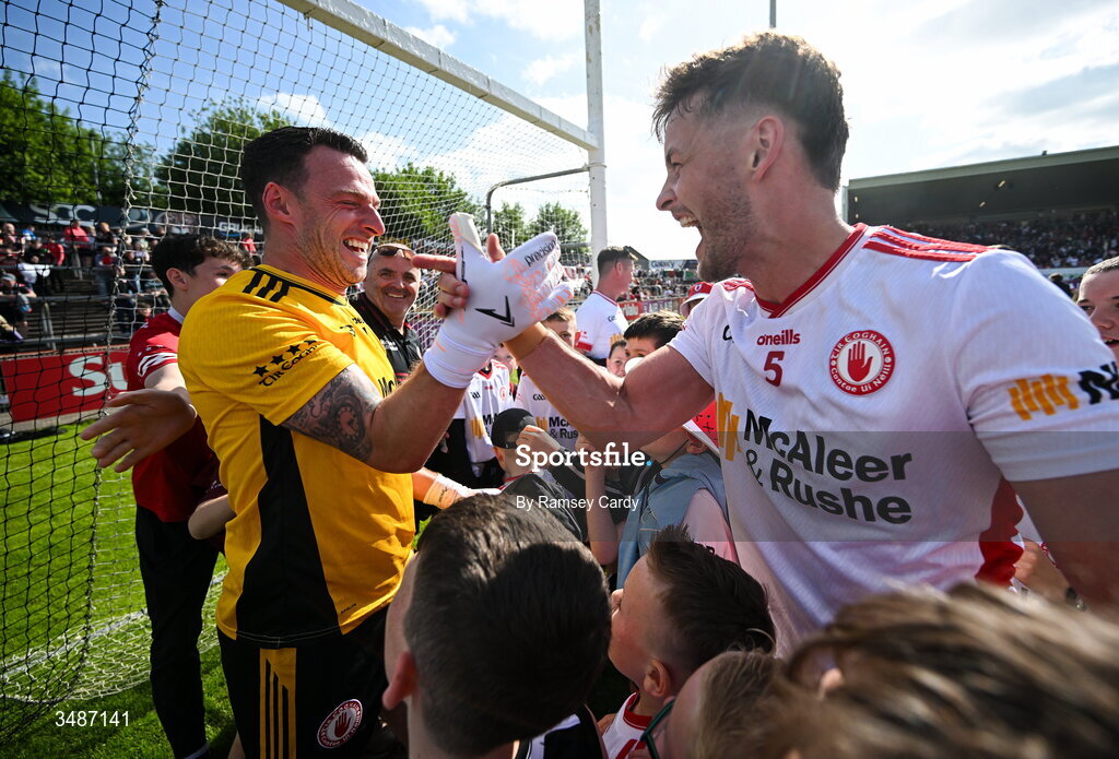 14 June 2026; Tyrone players Niall Morgan, left, and Michael McKernan celebrate after the GAA Football All-Ireland Senior Championship Round 2A match between Tyrone and Mayo at O’Neills Healy Park in Omagh, Tyrone. Photo by Ramsey Cardy/Sportsfile