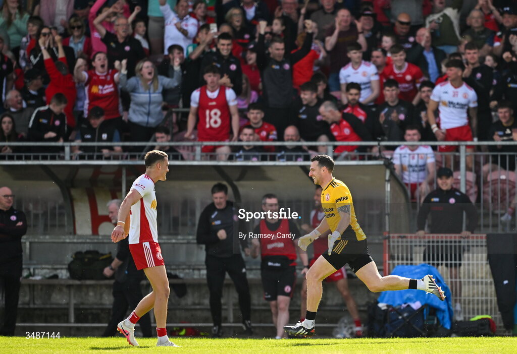 14 June 2026; Tyrone goalkeeper Niall Morgan, right, celebrates with Conn Kilpatrick after kicking the match winning score in the GAA Football All-Ireland Senior Championship Round 2A match between Tyrone and Mayo at O’Neills Healy Park in Omagh, Tyrone. Photo by Ramsey Cardy/Sportsfile