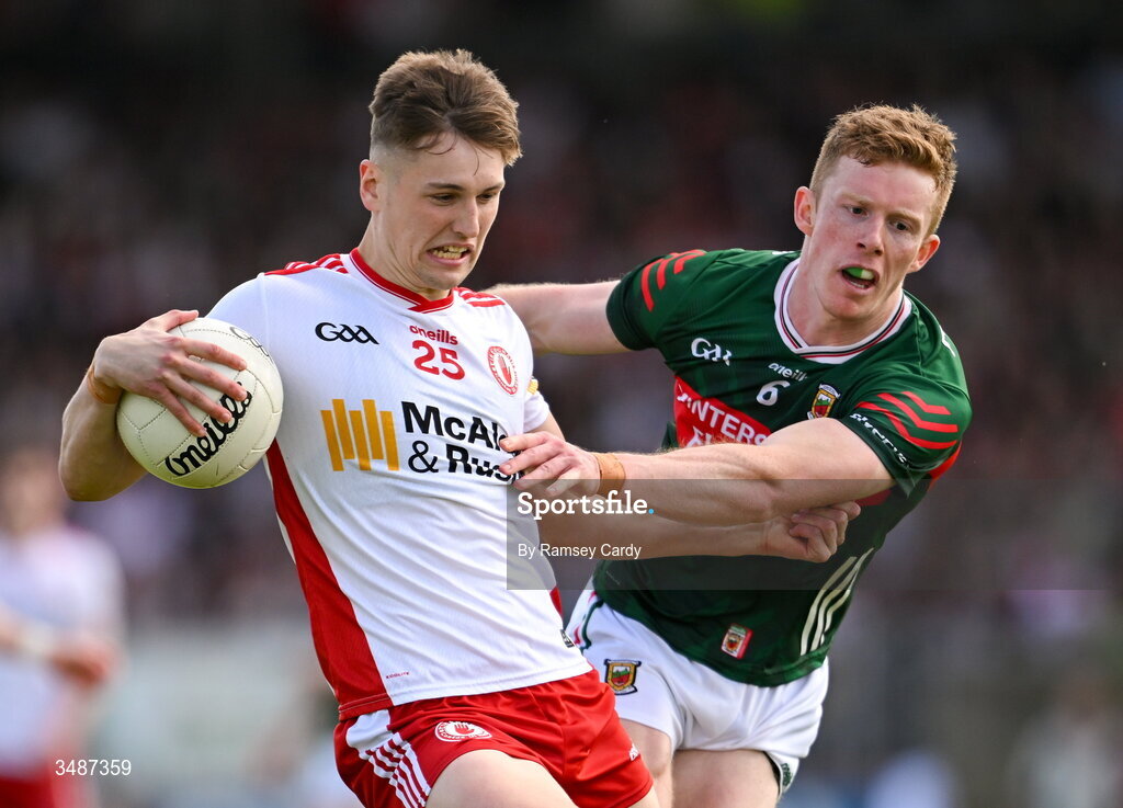 14 June 2026; Lorcan McGarrity of Tyrone in action against David McBrien of Mayo during the GAA Football All-Ireland Senior Championship Round 2A match between Tyrone and Mayo at O’Neills Healy Park in Omagh, Tyrone. Photo by Ramsey Cardy/Sportsfile