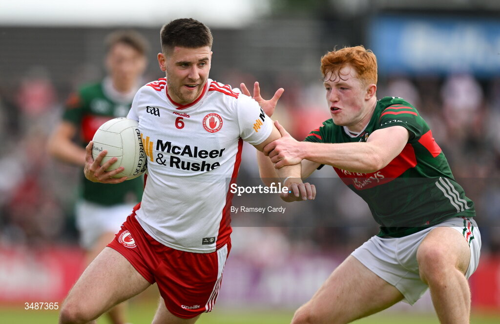 14 June 2026; Niall Devlin of Tyrone in action against Darragh Beirne of Mayo during the GAA Football All-Ireland Senior Championship Round 2A match between Tyrone and Mayo at O’Neills Healy Park in Omagh, Tyrone. Photo by Ramsey Cardy/Sportsfile