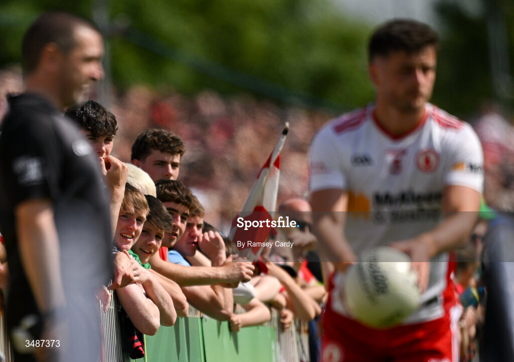 14 June 2026; Supporters watch on as Michael McKernan of Tyrone takes a sideline kick during the GAA Football All-Ireland Senior Championship Round 2A match between Tyrone and Mayo at O’Neills Healy Park in Omagh, Tyrone. Photo by Ramsey Cardy/Sportsfile