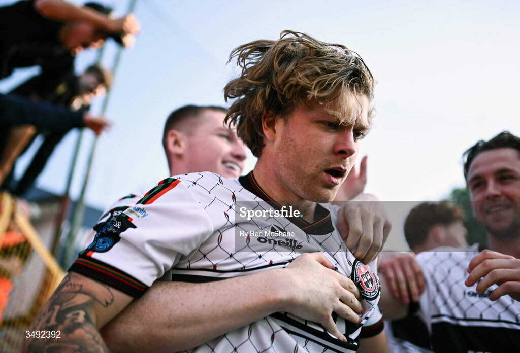22 June 2026; Harry Vaughan of Bohemians, centre, celebrates with teammates, including Ross Tierney, left, and Darragh Power, after scoring their side's first goal during the SSE Airtricity Men’s Premier Division match between Shelbourne and Bohemians at Tolka Park in Dublin. Photo by Ben McShane/Sportsfile