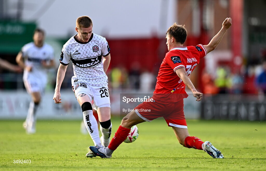 22 June 2026; Ross Tierney of Bohemians is tackled by James Norris of Shelbourne during the SSE Airtricity Men’s Premier Division match between Shelbourne and Bohemians at Tolka Park in Dublin. Photo by Ben McShane/Sportsfile