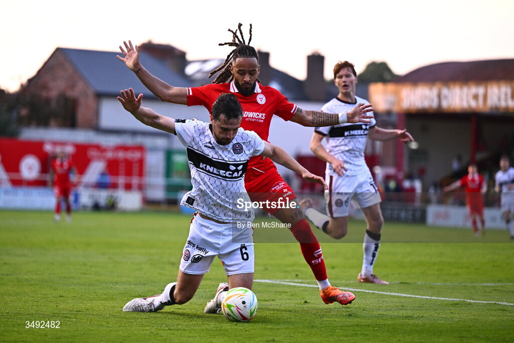 22 June 2026; Jordan Flores of Bohemians is tackled by Milan Mbeng of Shelbourne during the SSE Airtricity Men’s Premier Division match between Shelbourne and Bohemians at Tolka Park in Dublin. Photo by Ben McShane/Sportsfile