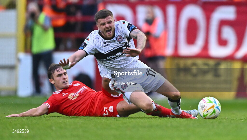22 June 2026; Adam McDonnell of Bohemians is tackled by Evan Caffrey of Shelbourne during the SSE Airtricity Men’s Premier Division match between Shelbourne and Bohemians at Tolka Park in Dublin. Photo by Tyler Miller/Sportsfile