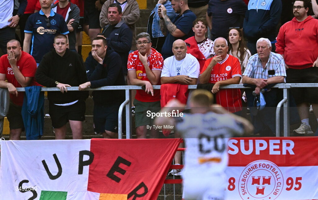 22 June 2026; Shelbourne supporters react as Ross Tierney of Bohemians celebrates scoring his side's third goal during the SSE Airtricity Men’s Premier Division match between Shelbourne and Bohemians at Tolka Park in Dublin. Photo by Tyler Miller/Sportsfile