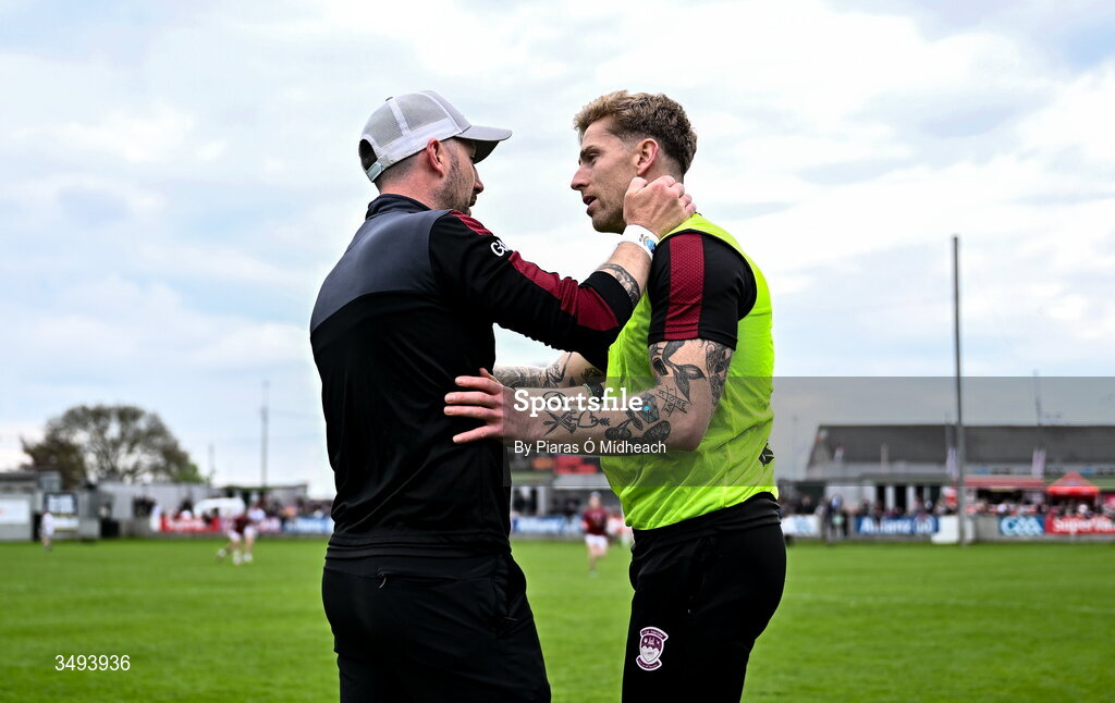 3 May 2026; Westmeath manager Mark McHugh, left, with injured Westmeath footballer Luke Loughlin in the closing stages of the Leinster GAA Football Senior Championship semi-final match between Kildare and Westmeath at Glenisk O'Connor Park in Tullamore, Offaly. Photo by Piaras Ó Mídheach/Sportsfile