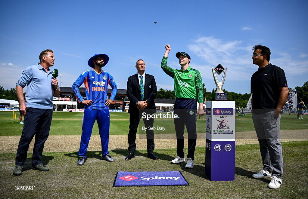 26 June 2026; Ireland captain Lorcan Tucker, with India captain Shreyas Iyer, match referee Dean Cosker, broadcaster Niall O'Brien, and Spinny founder and chief executive Niraj Singh before match one of the Spinny Cup Men's T20 International series between Ireland and India at Stormont in Belfast. Photo by Seb Daly/Sportsfile