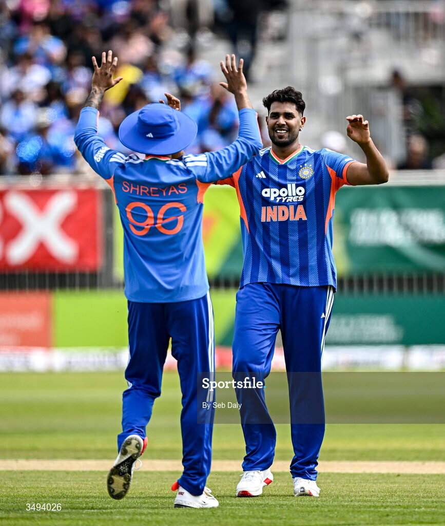 26 June 2026; India bowler Harshit Rana, right, is congratulated by captain Shreyas Iyer after taking the wicket of Ireland batter Lorcan Tucker during match one of the Spinny Cup Men's T20 International series between Ireland and India at Stormont in Belfast. Photo by Seb Daly/Sportsfile