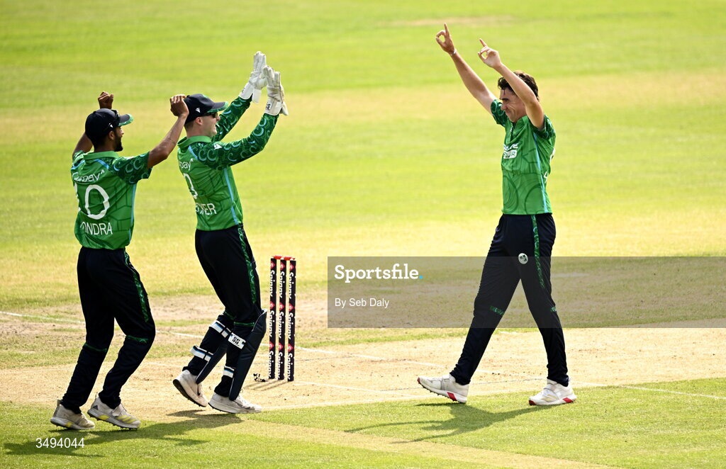 26 June 2026; Ireland bowler Matthew Hollard, right, celebrates with teammates Lorcan Tucker and Jai Moondra after taking the wicket of India batter Shreyas Iyer during match one of the Spinny Cup Men's T20 International series between Ireland and India at Stormont in Belfast. Photo by Seb Daly/Sportsfile
