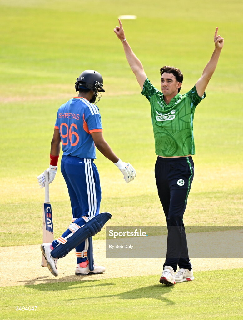 26 June 2026; Ireland bowler Matthew Hollard celebrates after taking the wicket of India batter Shreyas Iyer, left, during match one of the Spinny Cup Men's T20 International series between Ireland and India at Stormont in Belfast. Photo by Seb Daly/Sportsfile