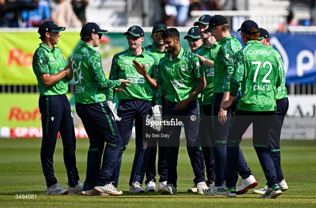 26 June 2026; Ireland bowler Jai Moondra, centre, is congratulated by teammates after taking the wicket of India batter Shivam Dube during match one of the Spinny Cup Men's T20 International series between Ireland and India at Stormont in Belfast. Photo by Seb Daly/Sportsfile