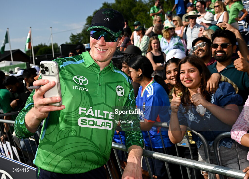 26 June 2026; Ireland's Harry Tector takes a selfie with supporters after match one of the Spinny Cup Men's T20 International series between Ireland and India at Stormont in Belfast. Photo by Seb Daly/Sportsfile