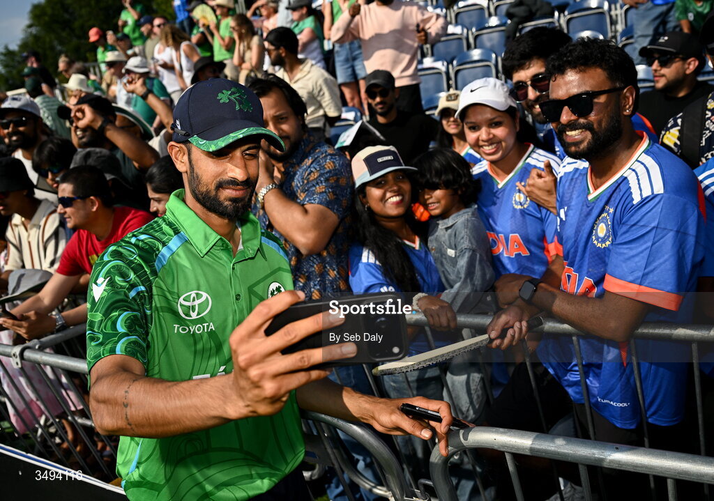 26 June 2026; Ireland's Jai Moondra takes a selfie with supporters after match one of the Spinny Cup Men's T20 International series between Ireland and India at Stormont in Belfast. Photo by Seb Daly/Sportsfile
