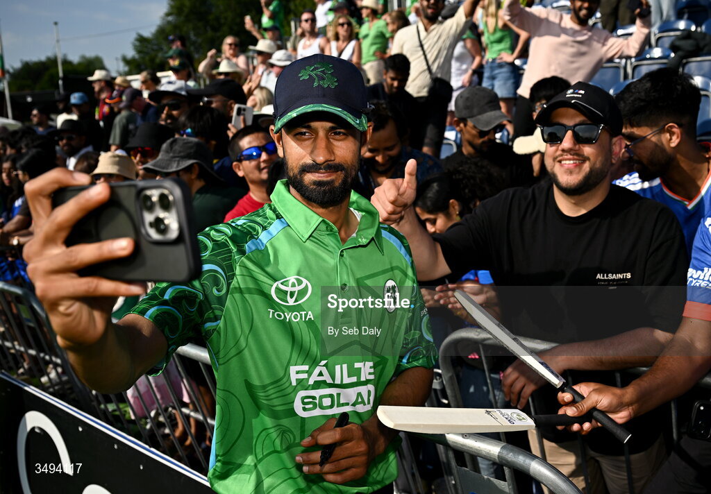 26 June 2026; Ireland's Jai Moondra takes a selfie with supporters after match one of the Spinny Cup Men's T20 International series between Ireland and India at Stormont in Belfast. Photo by Seb Daly/Sportsfile