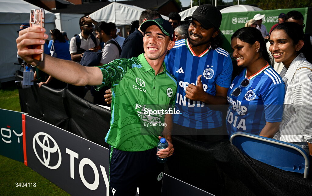 26 June 2026; Ireland's Matthew Hollard takes a selfie with supporters after match one of the Spinny Cup Men's T20 International series between Ireland and India at Stormont in Belfast. Photo by Seb Daly/Sportsfile