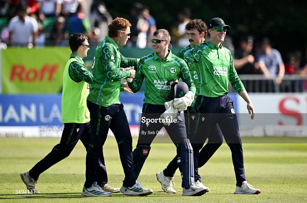 26 June 2026; Ireland captain Lorcan Tucker, centre, celebrates with teammates after their side's victory during match one of the Spinny Cup Men's T20 International series between Ireland and India at Stormont in Belfast. Photo by Seb Daly/Sportsfile