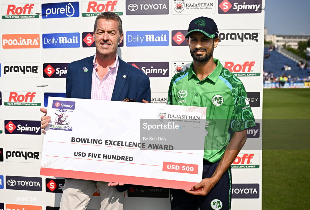 26 June 2026; Ireland's Jai Moondra is presented with the Bowling Excellence Award by chair of Cricket Ireland Brian MacNeice after match one of the Spinny Cup Men's T20 International series between Ireland and India at Stormont in Belfast. Photo by Seb Daly/Sportsfile