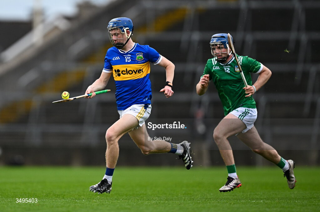 27 June 2026; Chris Dunne of Tipperary gets away from Limerick's Shane Waters during the Electric Ireland All-Ireland Minor Hurling Championship final match between Limerick and Tipperary at TUS Gaelic Grounds in Limerick. Photo by Seb Daly/Sportsfile