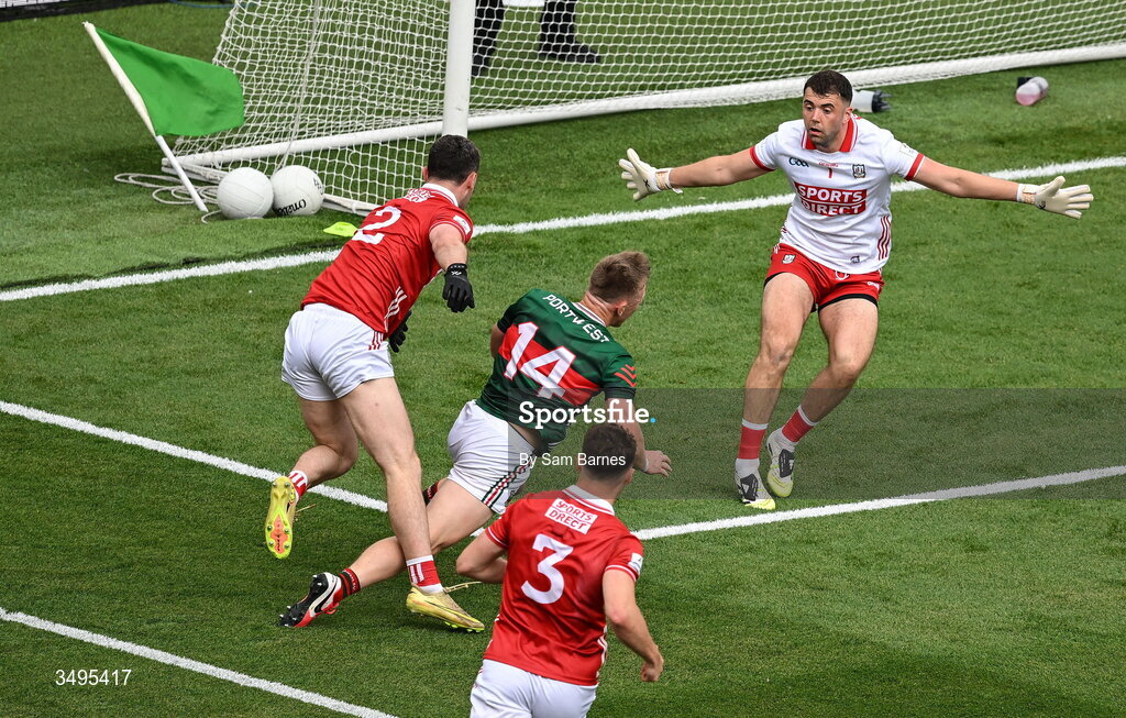 27 June 2026; Ryan O'Donoghue of Mayo goes down under the challenge of Maurice Shanley of Cork during the GAA Football All-Ireland Senior Championship quarter-final match between Cork and Mayo at Croke Park in Dublin. Photo by Sam Barnes/Sportsfile