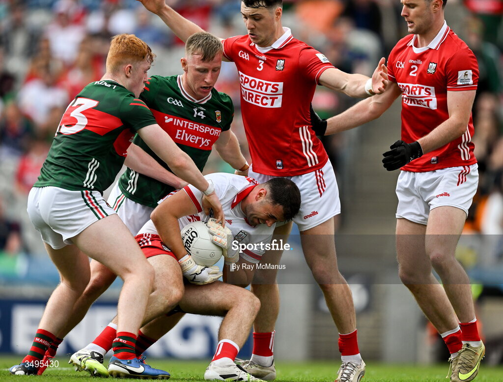 27 June 2026; Cork goalkeeper Patrick Doyle saves under pressure from fellow Cork players Daniel O'Mahony, 3, and Maurice Shanley and Mayo forwards Darragh Beirne, and Ryan O'Donoghue, 14, during the GAA Football All-Ireland Senior Championship quarter-final match between Cork and Mayo at Croke Park in Dublin. Photo by Ray McManus/Sportsfile