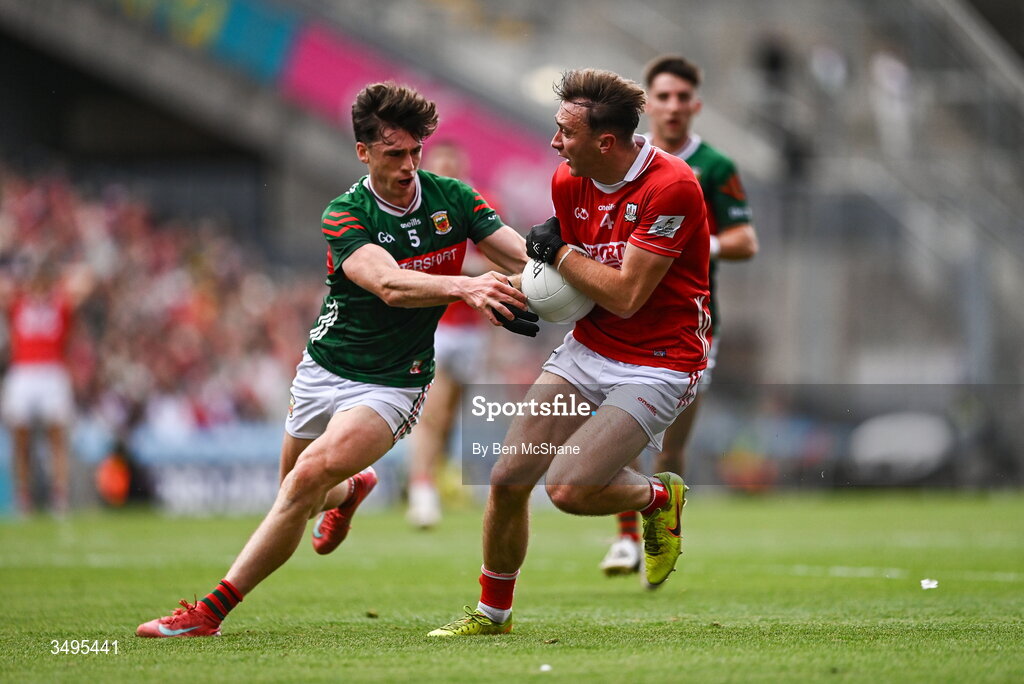 27 June 2026; Seán Meehan of Cork is tackled by Sam Callinan of Mayo during the GAA Football All-Ireland Senior Championship quarter-final match between Cork and Mayo at Croke Park in Dublin. Photo by Ben McShane/Sportsfile