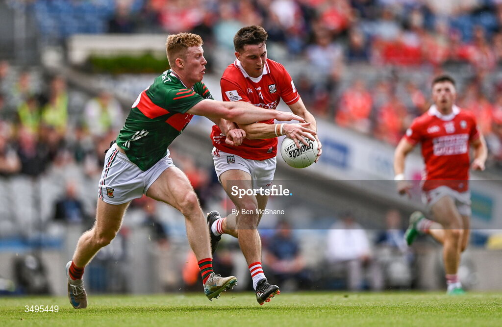 27 June 2026; Chris Óg Jones of Cork is tackled by David McBrien of Mayo during the GAA Football All-Ireland Senior Championship quarter-final match between Cork and Mayo at Croke Park in Dublin. Photo by Ben McShane/Sportsfile