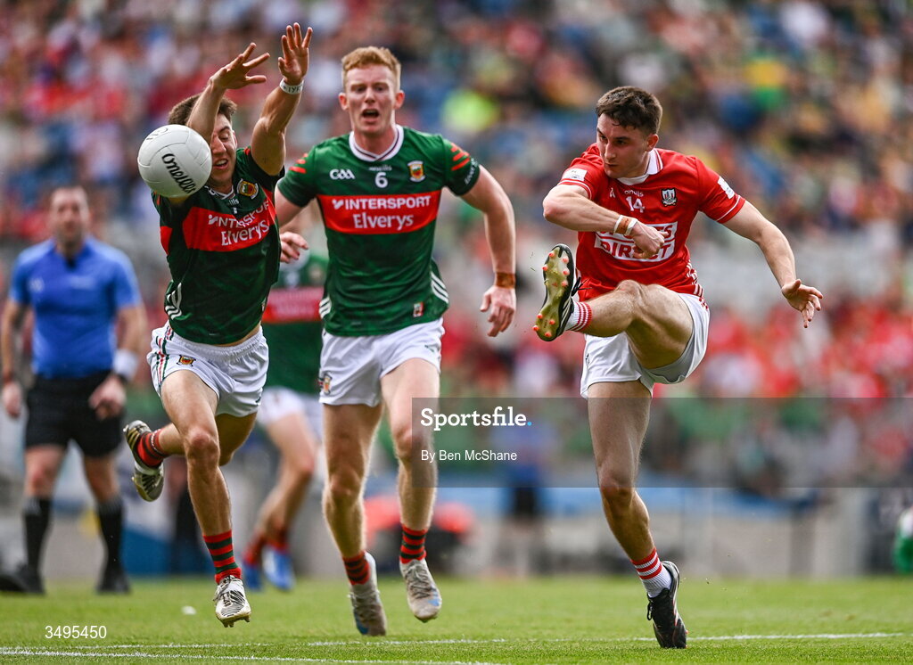 27 June 2026; Chris Óg Jones of Cork has a kick blocked by Enda Hession of Mayo during the GAA Football All-Ireland Senior Championship quarter-final match between Cork and Mayo at Croke Park in Dublin. Photo by Ben McShane/Sportsfile