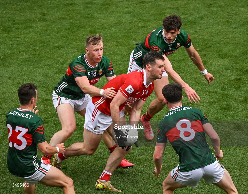 27 June 2026; Maurice Shanley of Cork in action against Mayo players, from left, Paul Towey, Ryan O Donoghue, Sam Callinan and Bob Touhy during the GAA Football All-Ireland Senior Championship quarter-final match between Cork and Mayo at Croke Park in Dublin. Photo by Sam Barnes/Sportsfile