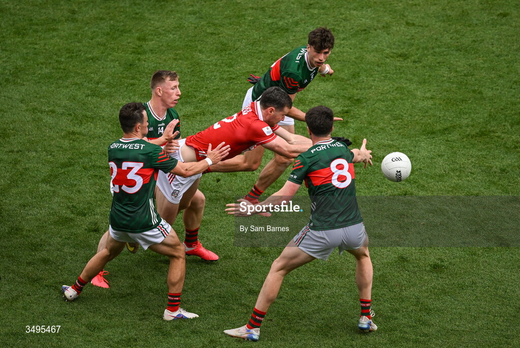 27 June 2026; Maurice Shanley of Cork in action against Mayo players, from left, Paul Towey, Ryan O Donoghue, Sam Callinan and Bob Touhy during the GAA Football All-Ireland Senior Championship quarter-final match between Cork and Mayo at Croke Park in Dublin. Photo by Sam Barnes/Sportsfile