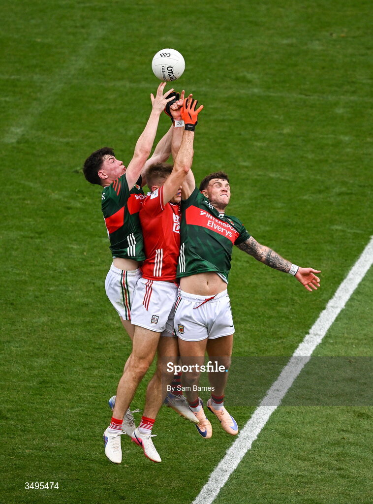 27 June 2026; Ian Maguire of Cork contests a high ball with Bob Touhy, left, and Jordan Flynn of Mayo during the GAA Football All-Ireland Senior Championship quarter-final match between Cork and Mayo at Croke Park in Dublin. Photo by Sam Barnes/Sportsfile