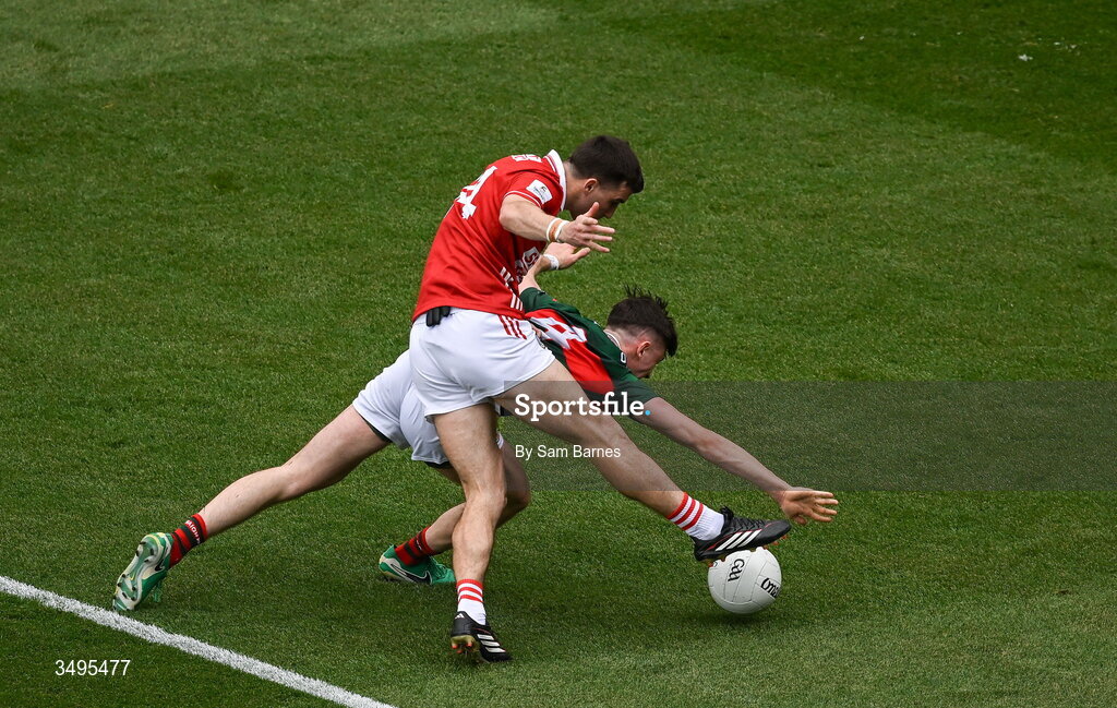 27 June 2026; Chris Óg Jones of Cork has a shot on goal despite the efforts of Eoin McGreal of Mayo during the GAA Football All-Ireland Senior Championship quarter-final match between Cork and Mayo at Croke Park in Dublin. Photo by Sam Barnes/Sportsfile