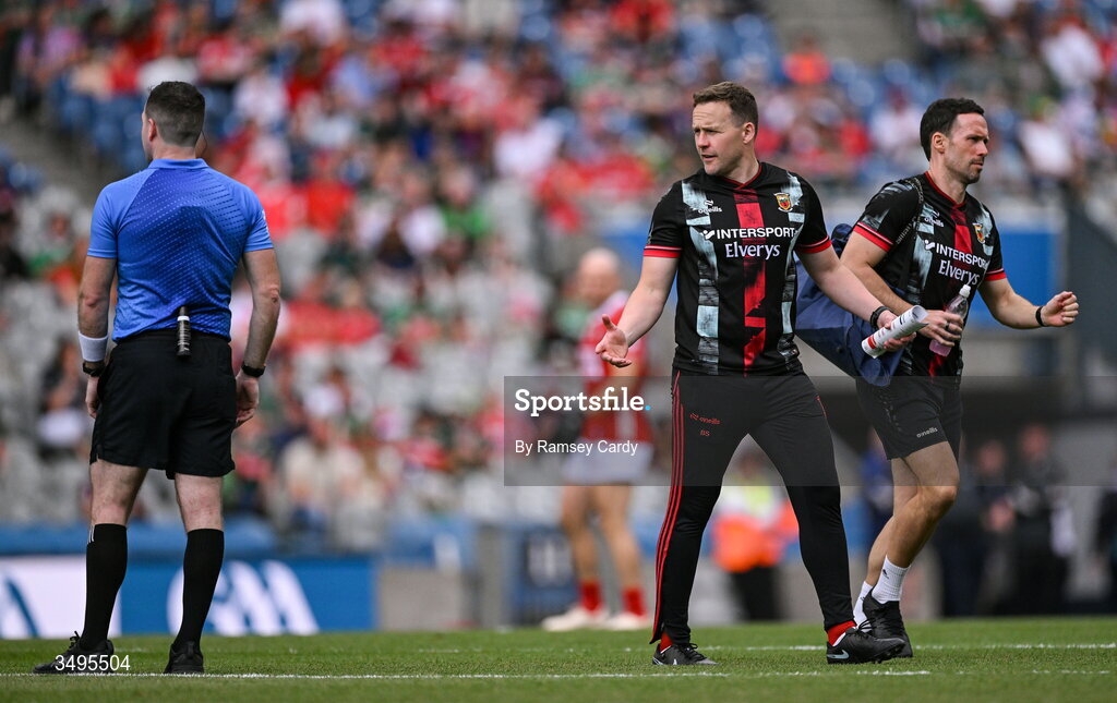 27 June 2026; Mayo manager Andy Moran speaks with referee Martin McNally at half-time of the GAA Football All-Ireland Senior Championship quarter-final match between Cork and Mayo at Croke Park in Dublin. Photo by Ramsey Cardy/Sportsfile