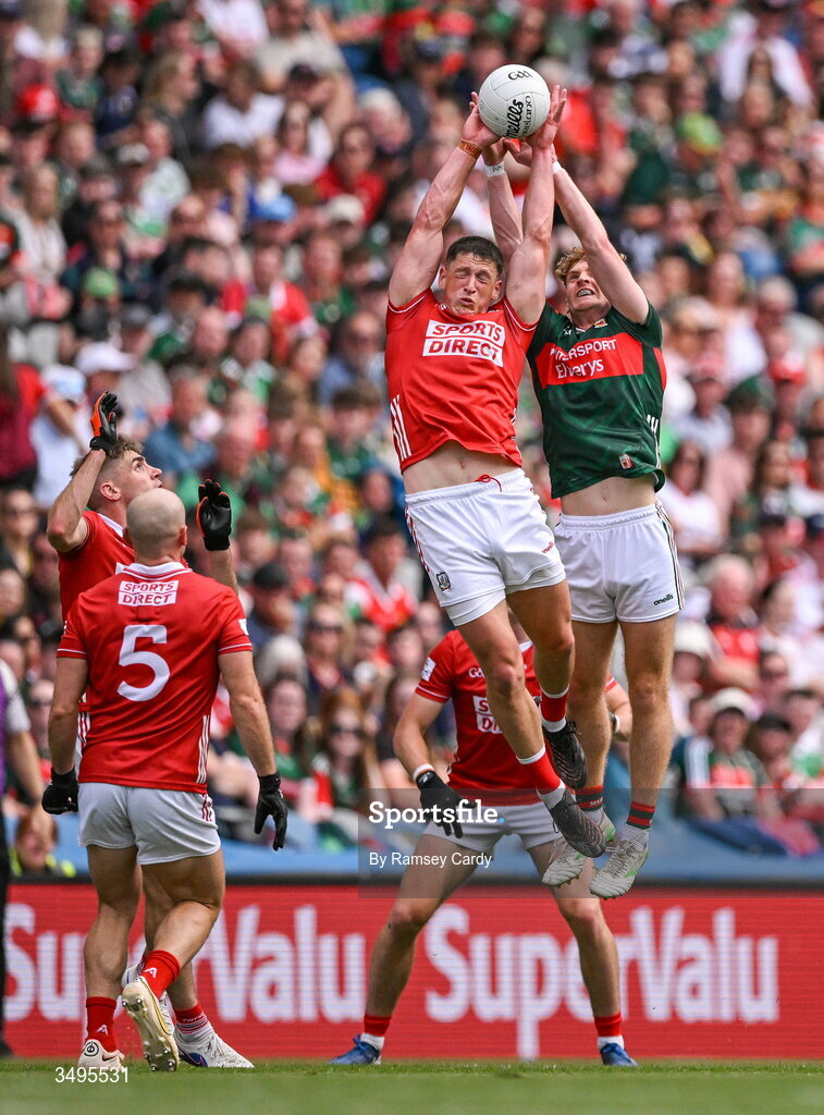 27 June 2026; Colm O'Callaghan of Cork in action against Jack Carney of Mayo during the GAA Football All-Ireland Senior Championship quarter-final match between Cork and Mayo at Croke Park in Dublin. Photo by Ramsey Cardy/Sportsfile