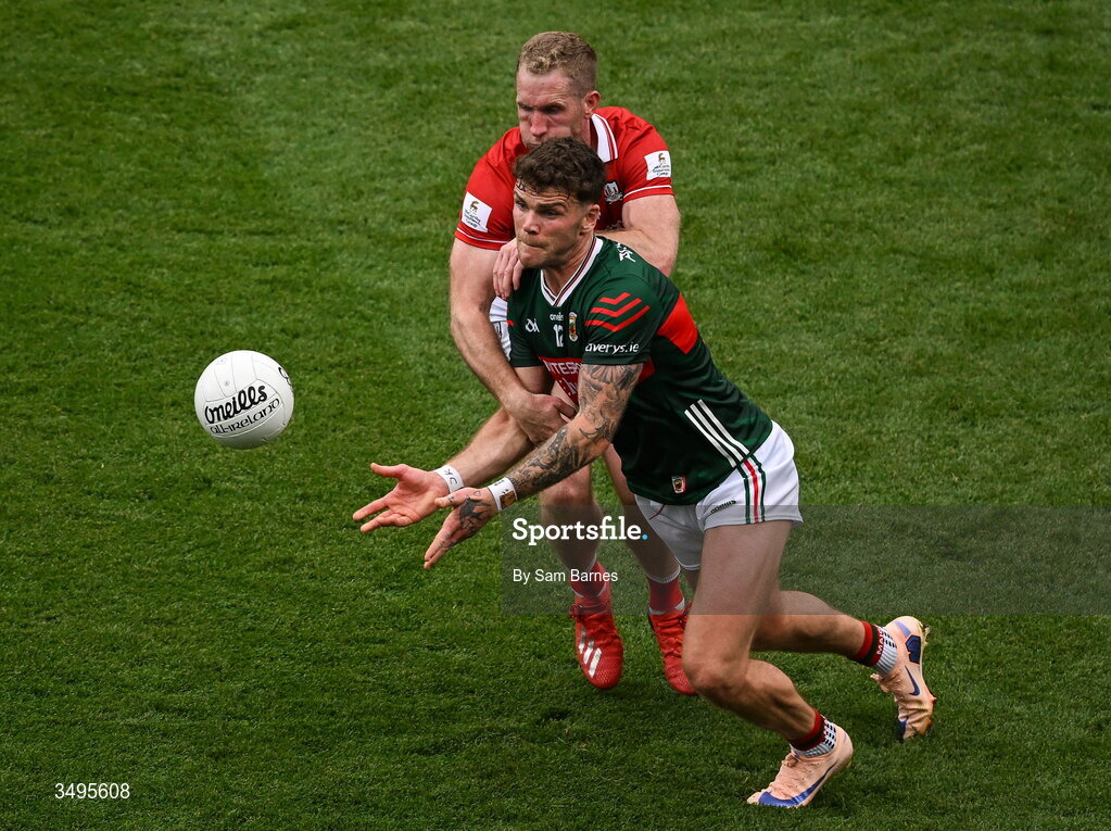 27 June 2026; Jordan Flynn of Mayo in action against Ruairi Deane of Cork during the GAA Football All-Ireland Senior Championship quarter-final match between Cork and Mayo at Croke Park in Dublin. Photo by Sam Barnes/Sportsfile